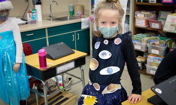 Girl is dressed as a book character